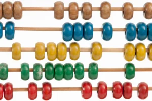 Close-up of an abacus with four rows of colorful wooden beads on rods. Beads are blue, yellow, green, and red, evoking a playful, educational mood.